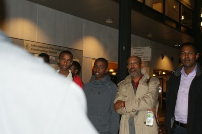 Somali Community in Oslo and Professor Ahmed Ismail Samatar standing outside in the front door Hall meeting.